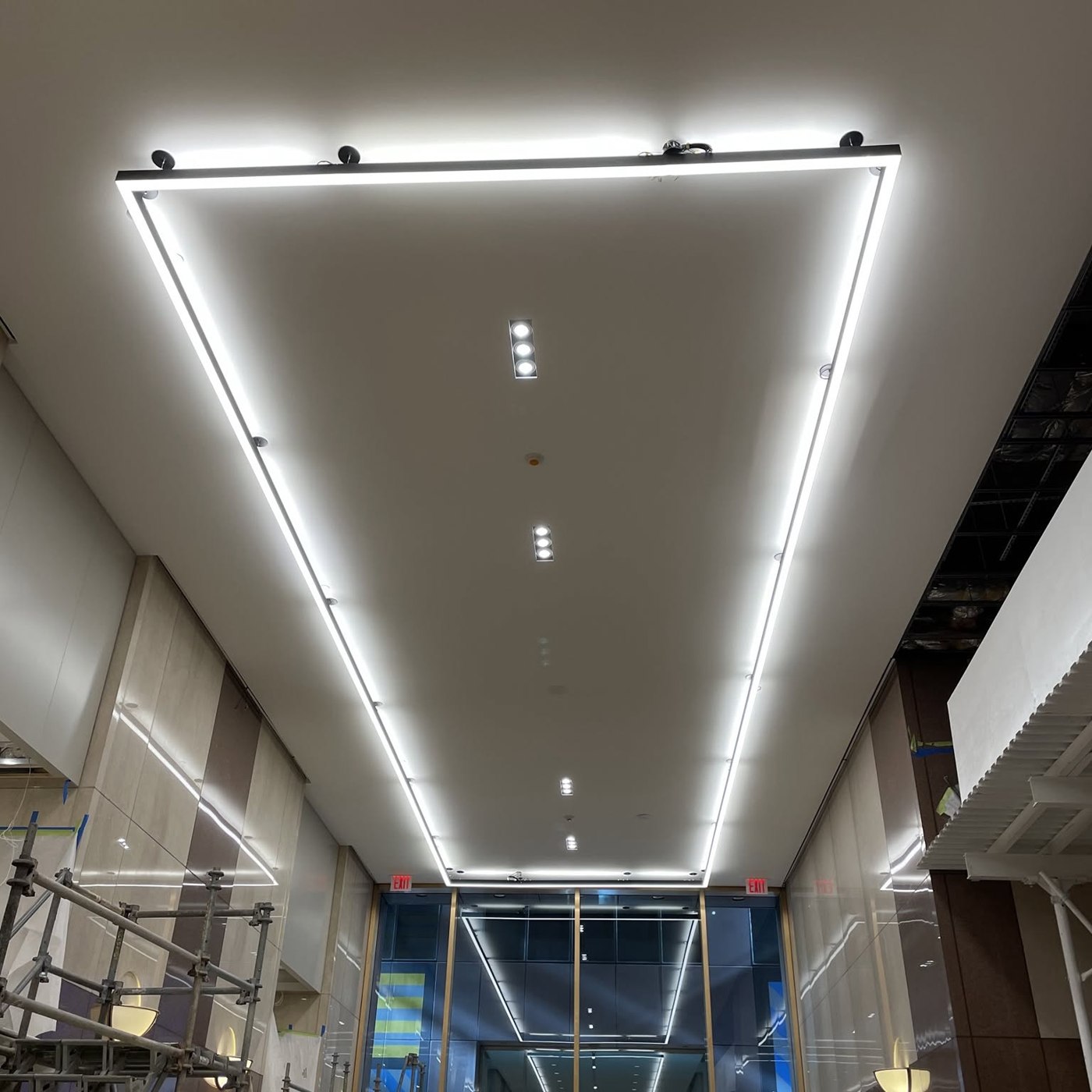 Linear LED ceiling light fixtures installed in a commercial space