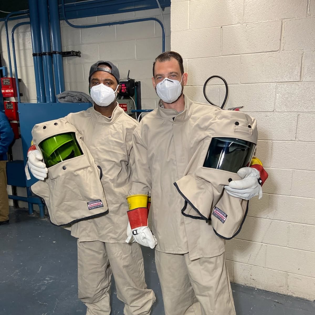 Midnight Electric Corp. crew suited up in PPE on a commercial job site