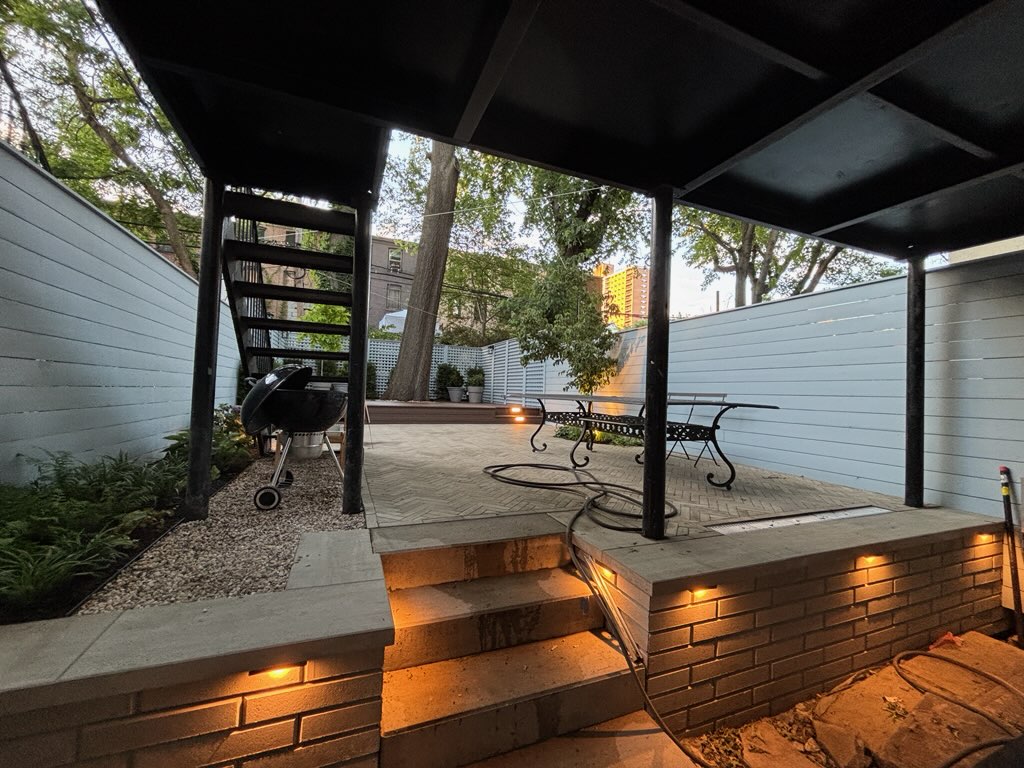 String lighting strung across the finished backyard patio